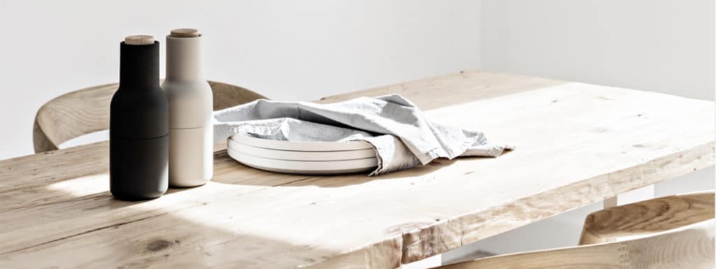 Natural homewares on a minimalist timber dining table