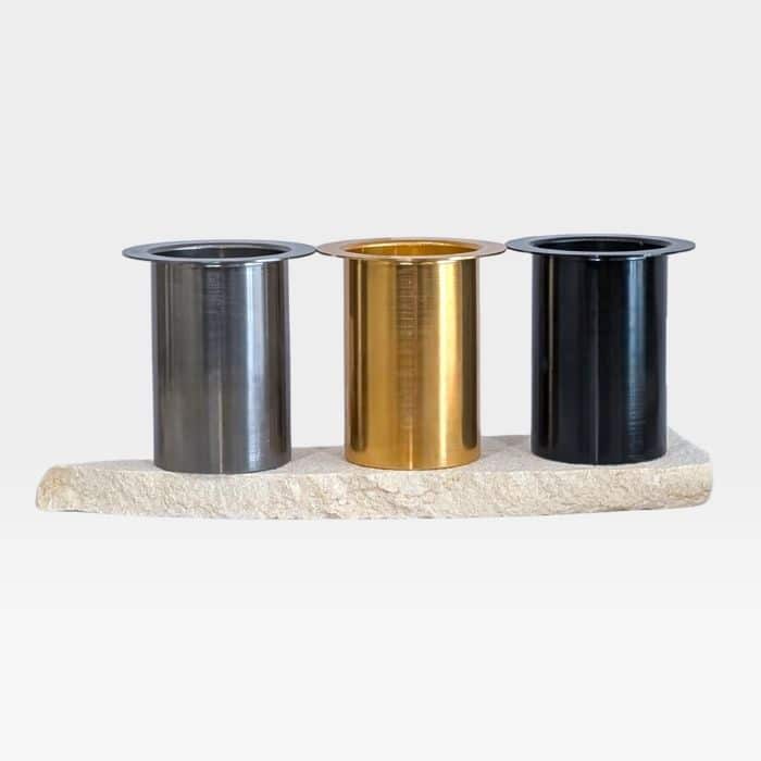 Refillable metal candle inserts in gold, silver and black finishes designed for stone candle holders