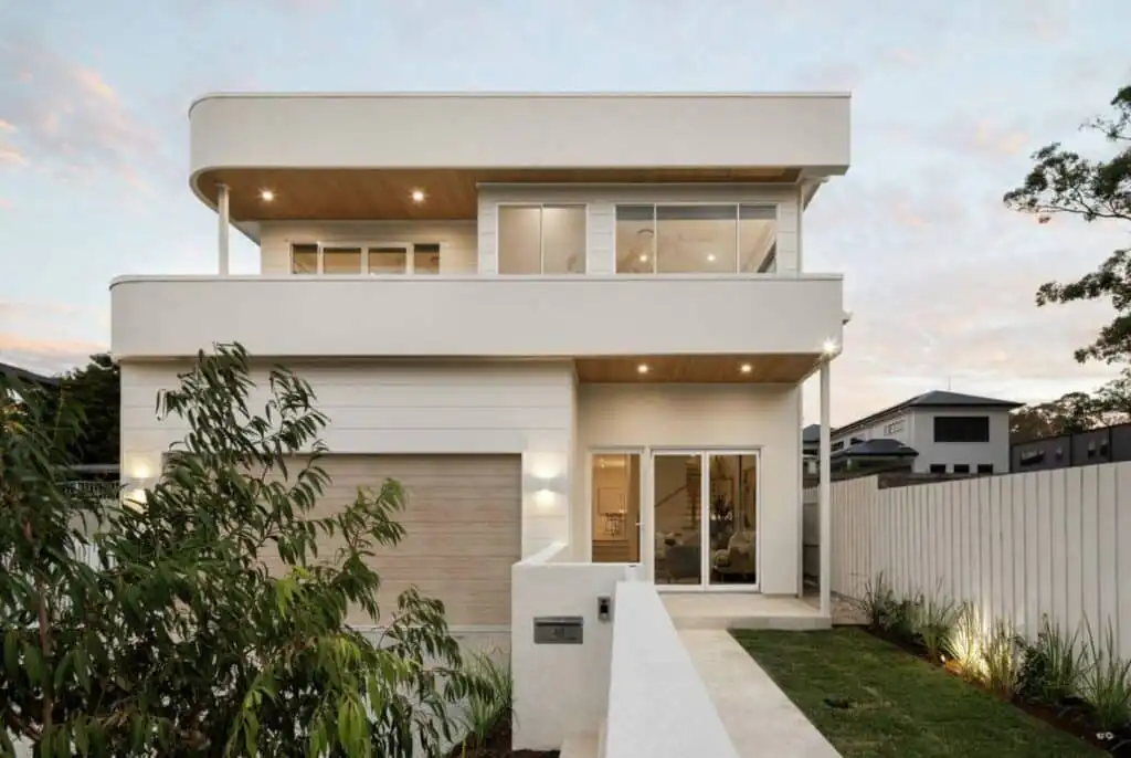 Crema Novelda brushed and tumbled limestone tiles used along the outdoor entrance of a contemporary Queensland home