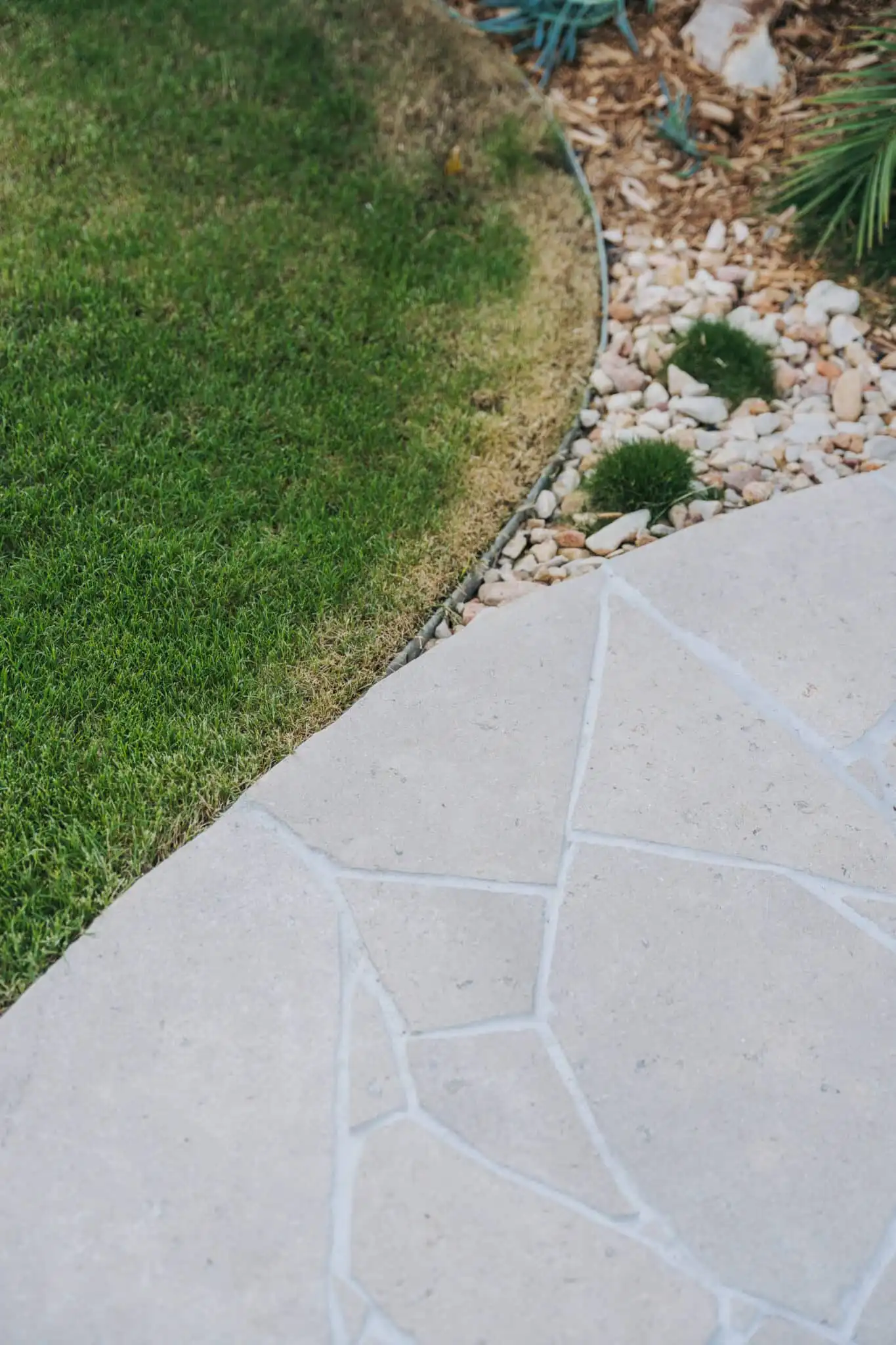 Close-up of Sinai Pearl limestone crazy paving showing natural texture and fossil detail