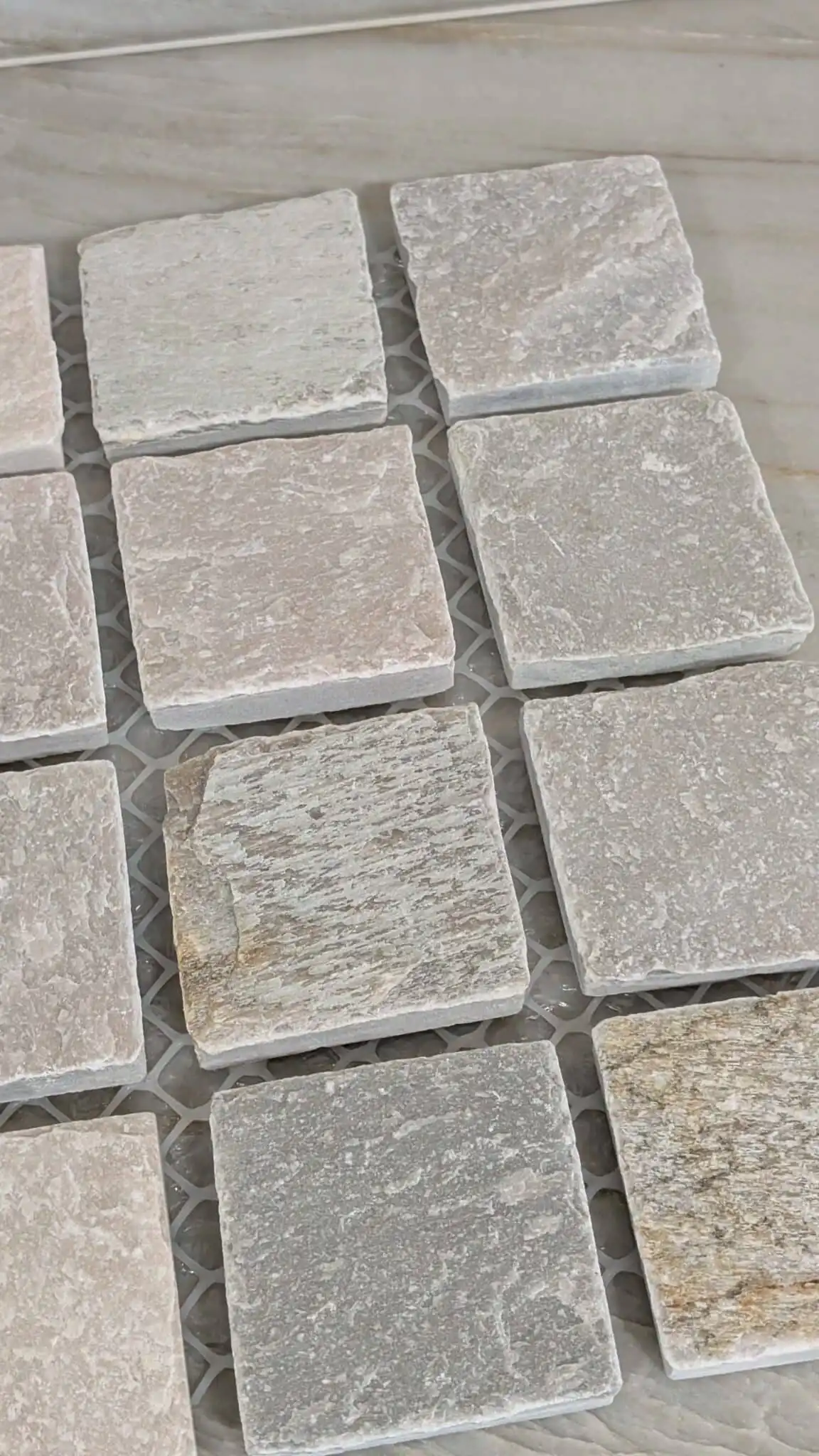 Close-up detail of Sorrento Quartz Split Cobblestone showing natural quartz texture and split stone surface