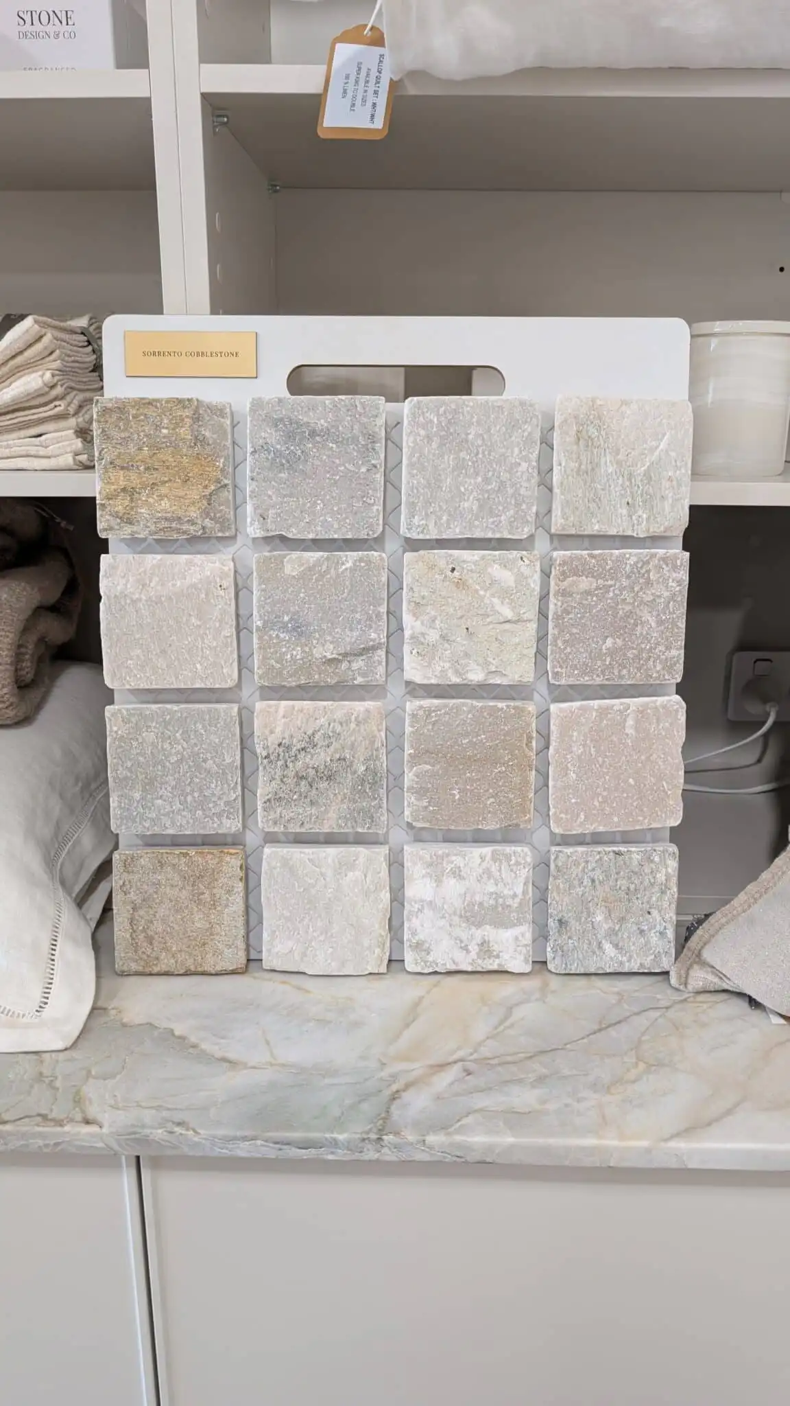 Sorrento Quartz Split Cobblestone driveway featuring natural riven texture and soft grey and cream tones