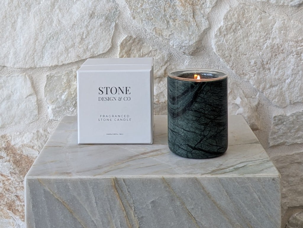 Stone Design & Co natural refillable stone candle in deep green marble with white gift box, sustainable fragranced candle on stone plinth – Australian luxury home fragrance brand.