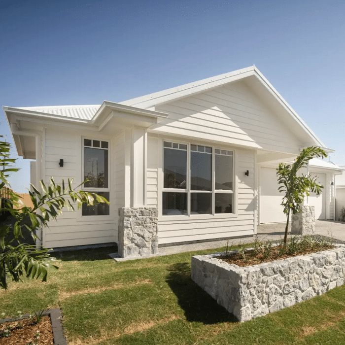 Modern Australian coastal home featuring Stone Design & Co natural stone wall cladding and planter detail, highlighting sustainable exterior design.